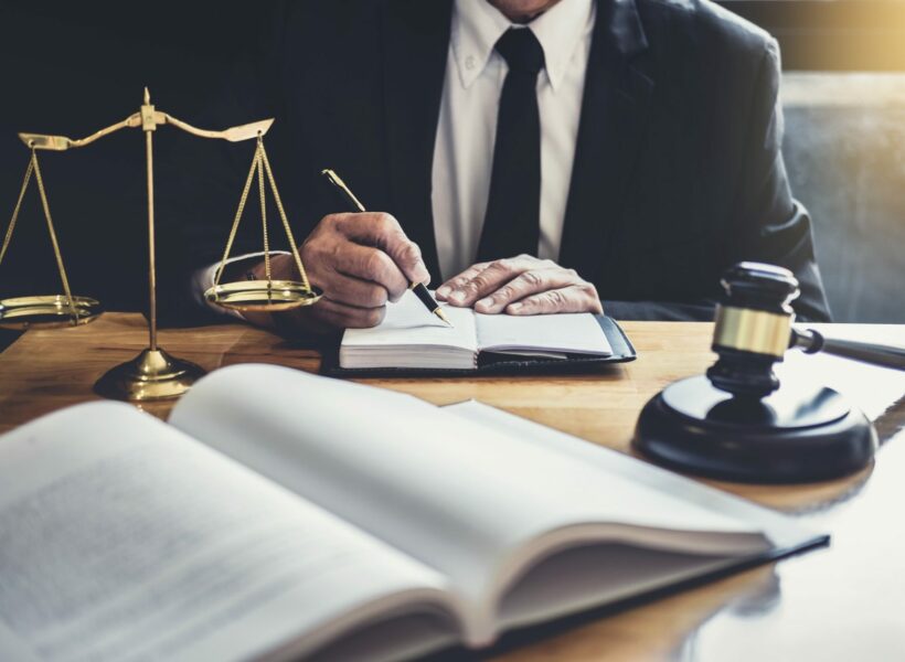 male lawyer or judge working with contract papers.jpg